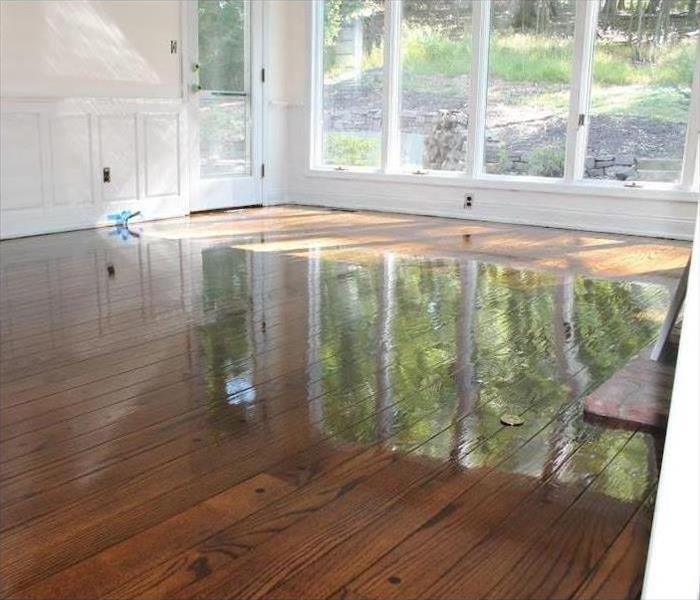 These wood floors were soaked due to wall pipe burst
